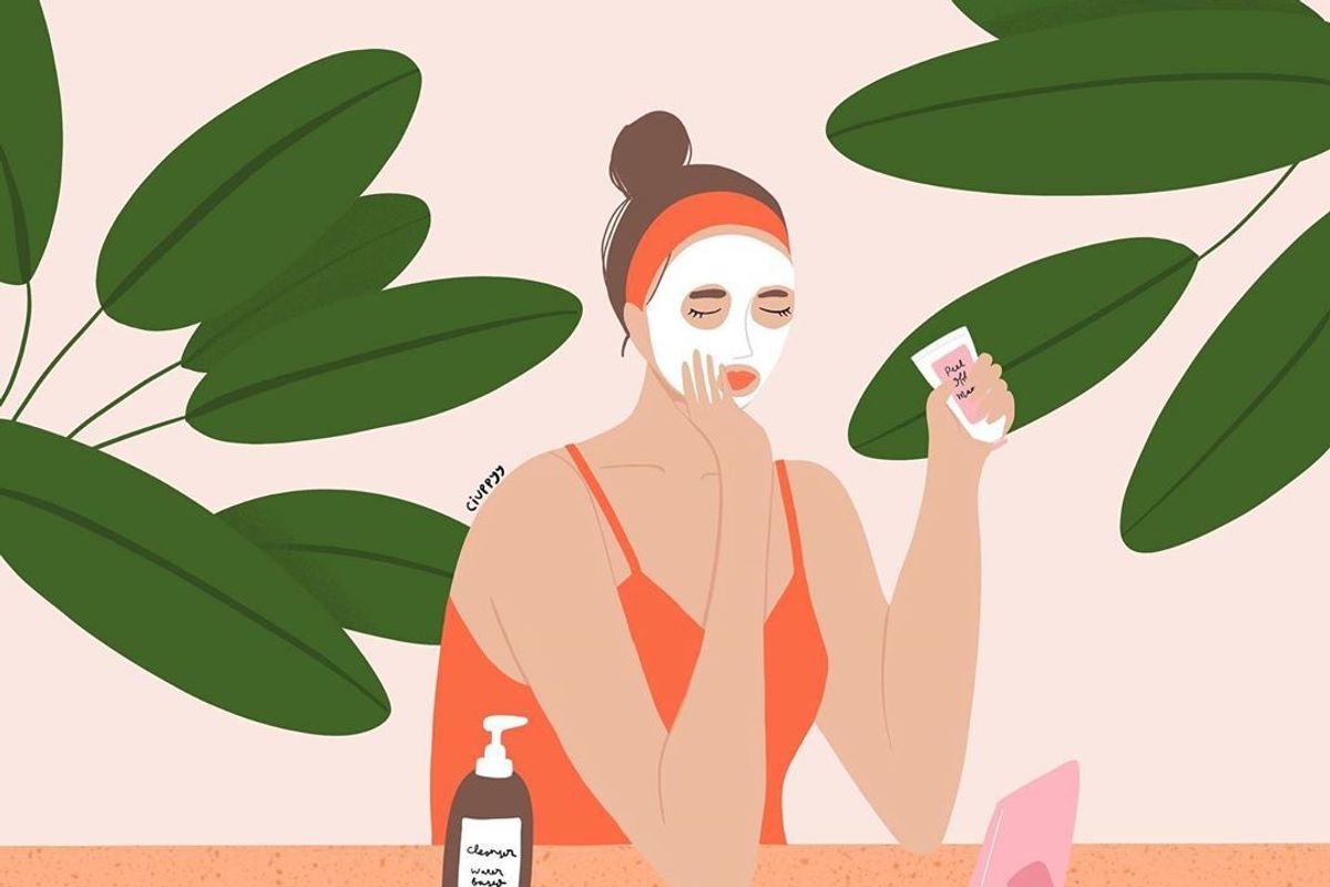 Illustration of woman in front of a mirror applying a face mask surrounded by large plants. 