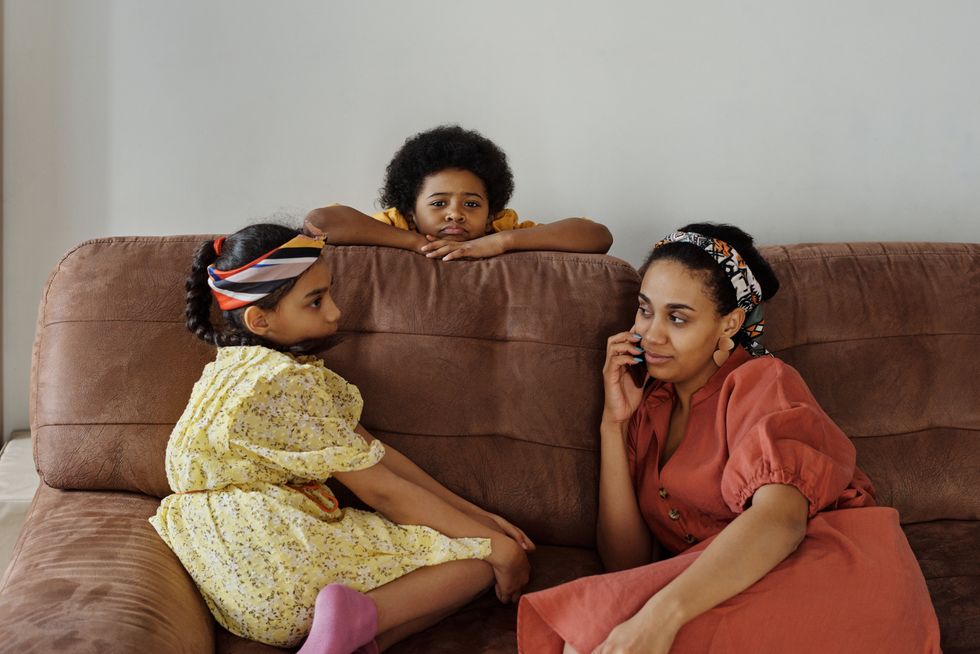 https://www.pexels.com/photo/mother-and-children-on-a-sofa-4262185/