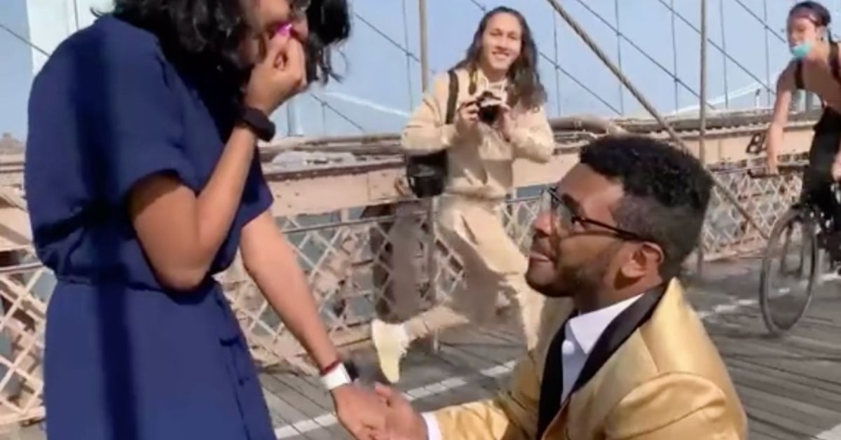 Guy's Proposal On The Brooklyn Bridge Goes Painfully Awry After Cyclist Slams Into Photographer