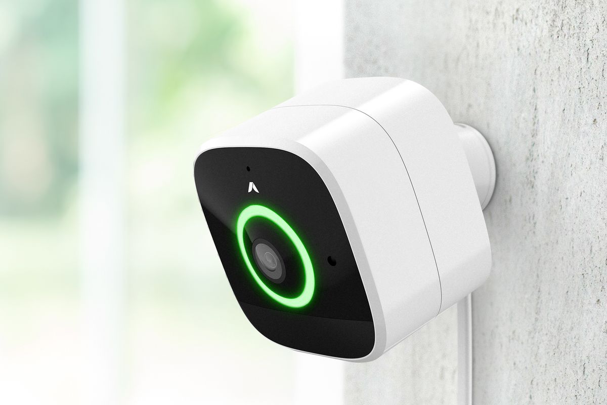 abode outdoor smart camera mounted on the side of a house.