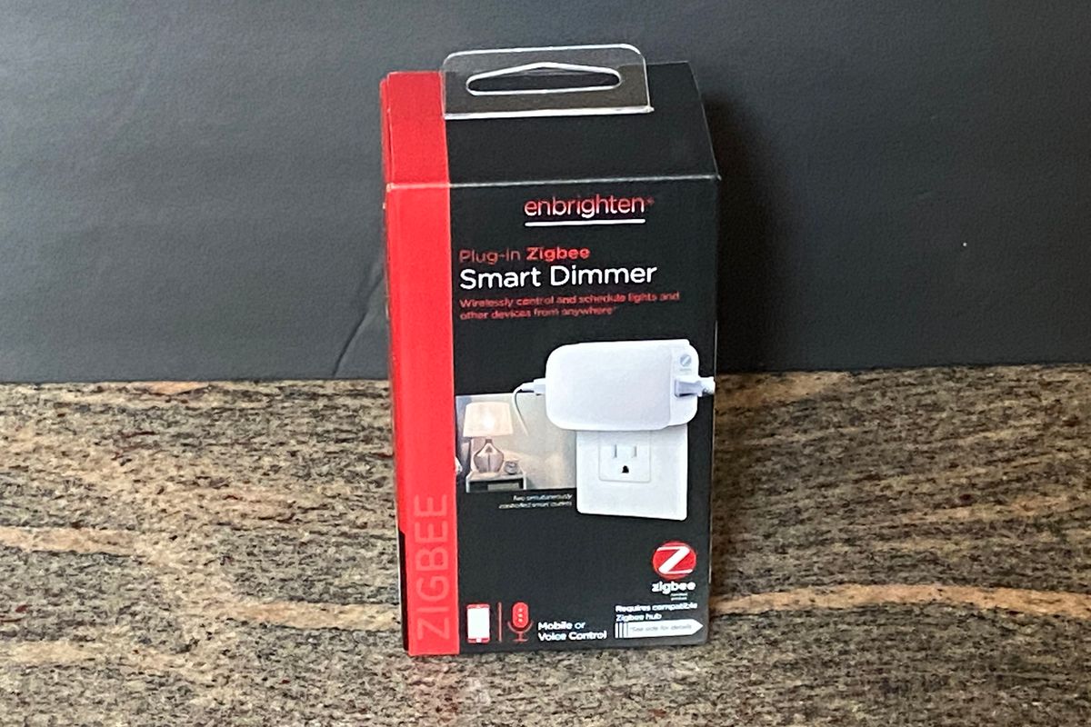 Jasco Enbrighten Plug-in Smart Dimmer in a box on a counter