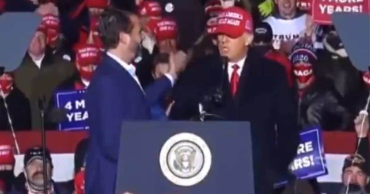 Twitter LOLs Over Awkward Video Of President Trump Appearing To Reject A Hug From Don Jr.