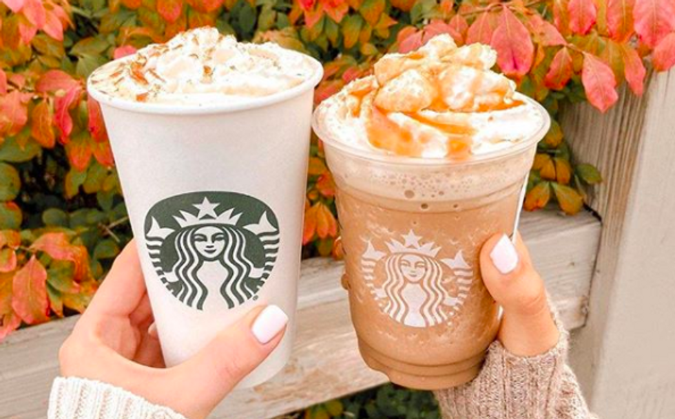 one hot and cold starbucks drink next to each other with red leaves in the background