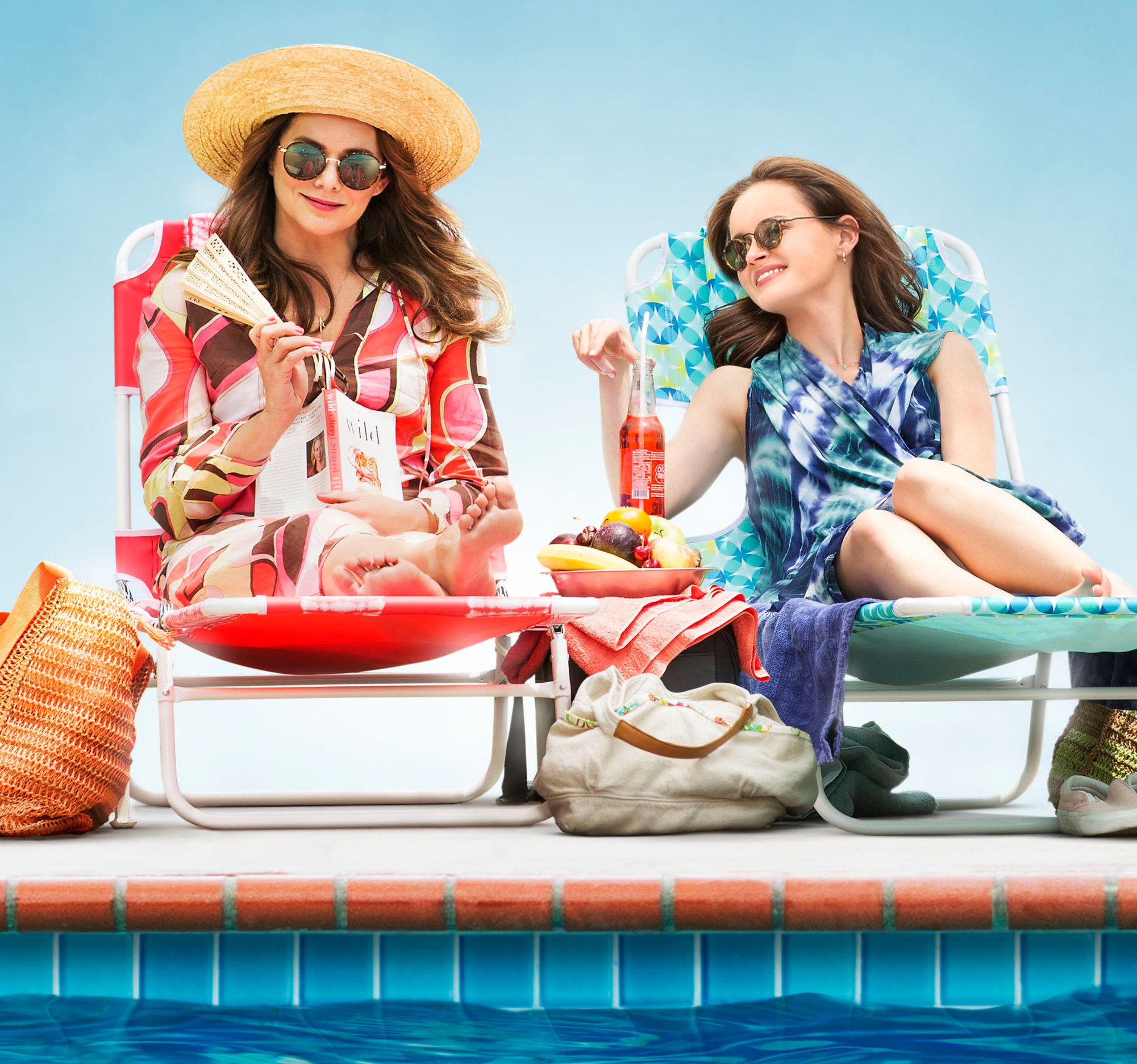 Lauren Graham as Lorelai Gilmore and Alexis Bledel as Rory Gilmore hanging out at a pool