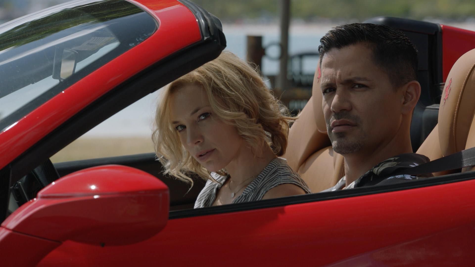 Juliet Higgins and Thomas Magnum in a Ferrari
