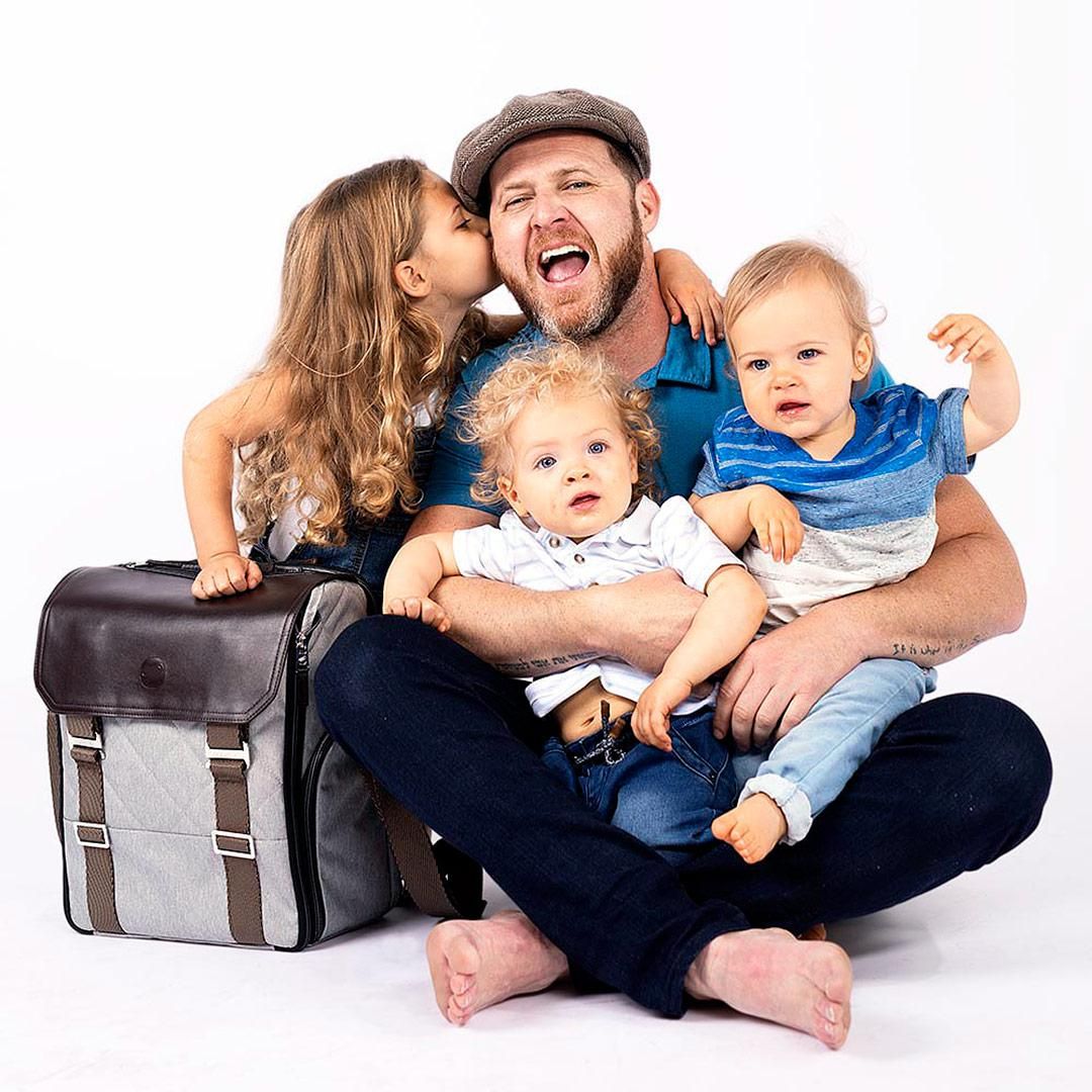 SEAL Team actor AJ Buckley sits with his three children and the well-designed patented diaper bag.