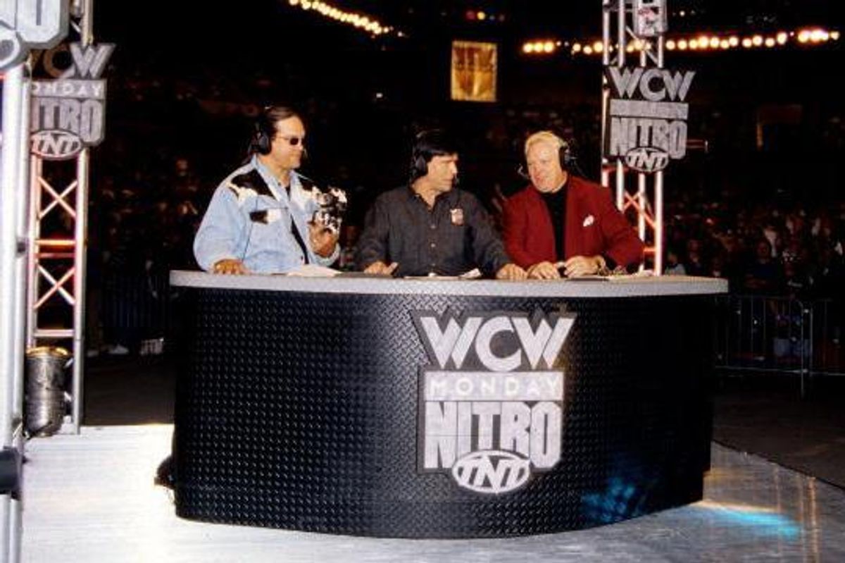 Steve McMichael Eric Bischoff and Bobby Heenan at the Monday Nitro commentator's desk