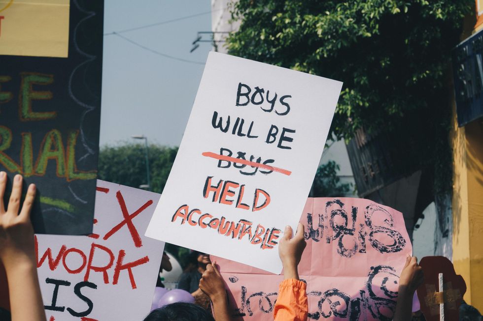 poster reading "boys will be held accountable"