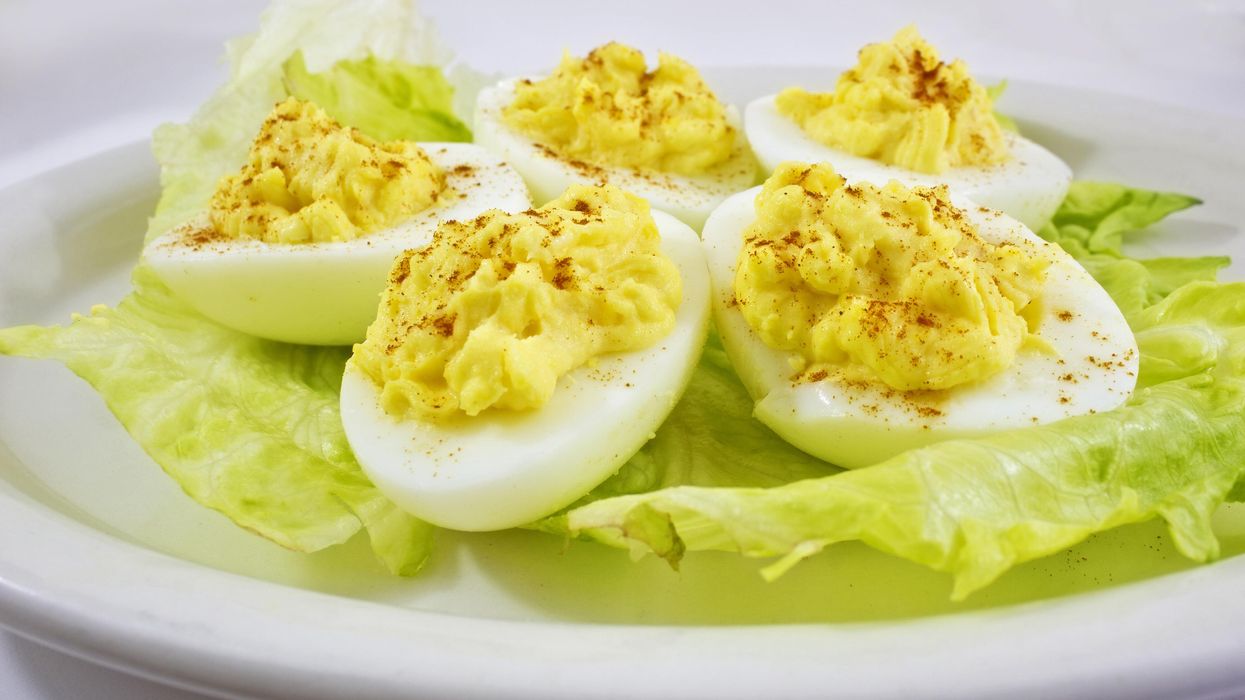 Deviled eggs on a plate with lettuce