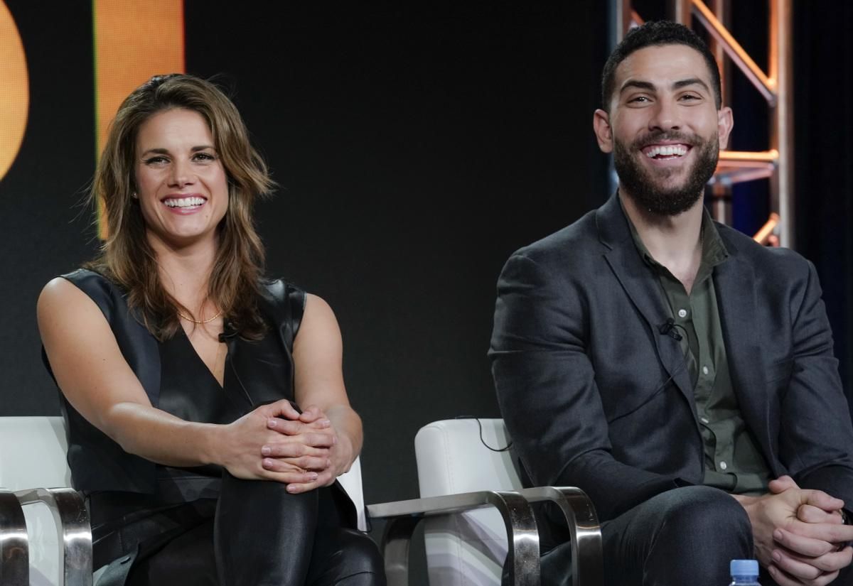 ​Missy Peregrym and Zeeko Zaki sitting onstage at a panel discussion