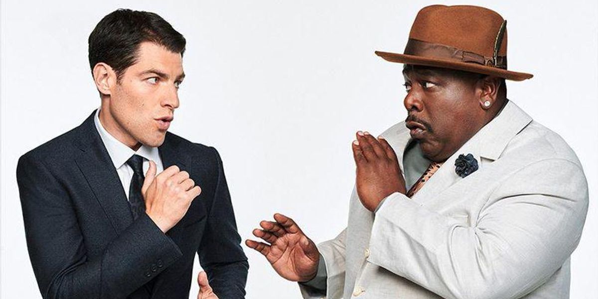Max Greenfield and Cedric The Entertainer face off in fighting stances