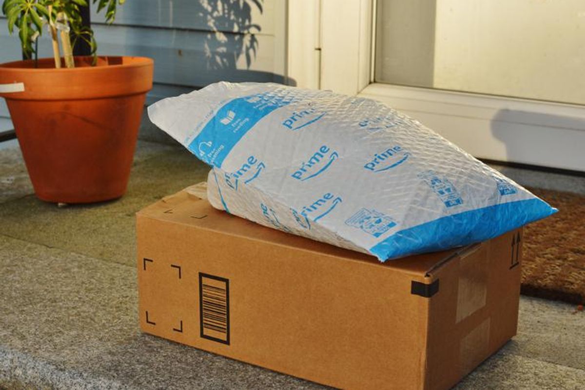 Amazon Prime boxes on a front porch of a home