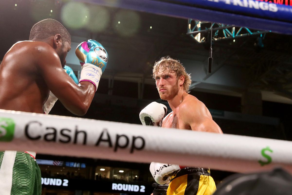 Floyd Mayweather and Logan Paul fight during their exhibition boxing match at Hard Rock Stadium on June 06, 2021