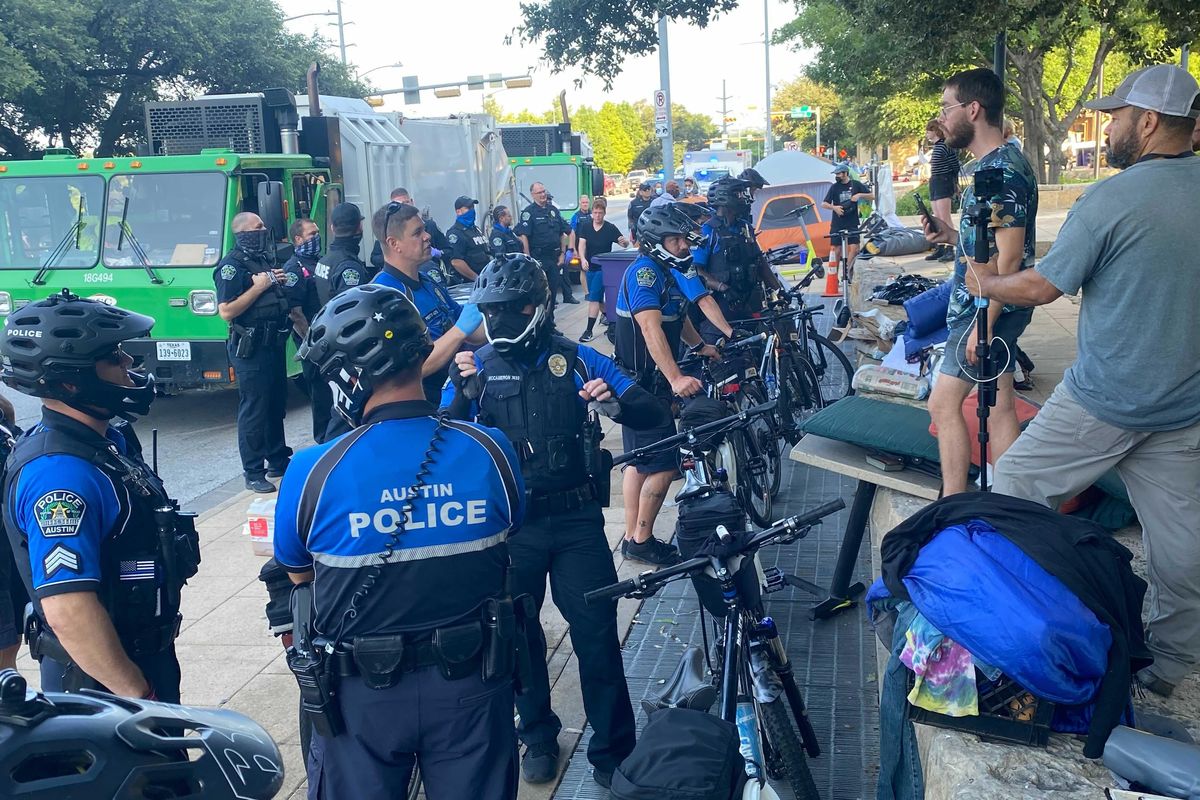 Police arrest seven people outside City Hall as tents cleared