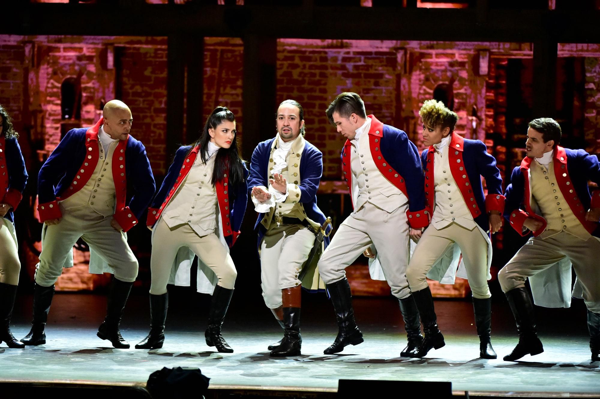 Lin-Manuel Miranda and the cast of Hamilton in costume performing at the 2016 Tony Awards
