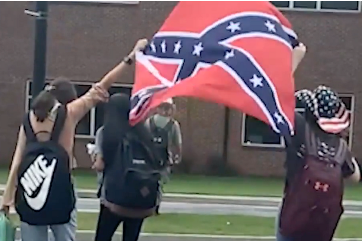 Students carrying a confederate flag