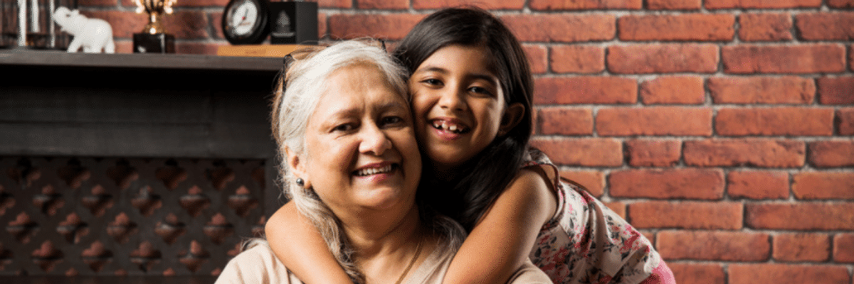 granddaughter hugging grandmother