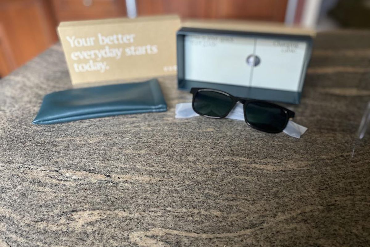Photo of Vue Lite 2 Smart Audio Sunglasses unboxed on a countertop.