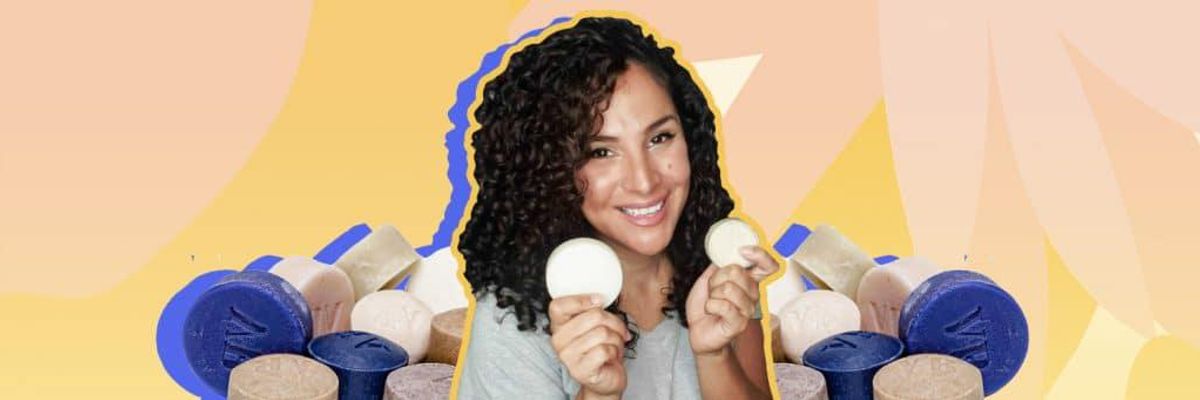 latina woman, Ana Nuñez, surrounded by, and holding, bars of soap from her brand "Vida Bars"