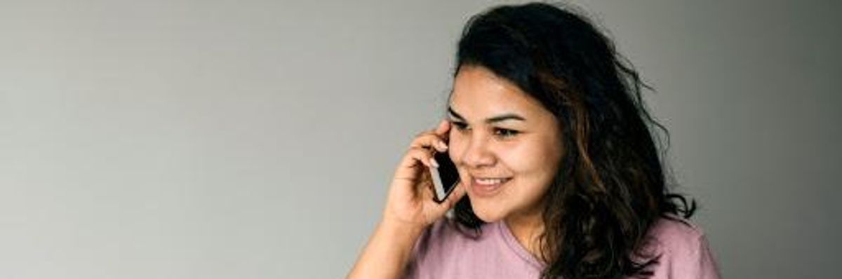 Latina woman talking on her cellphone