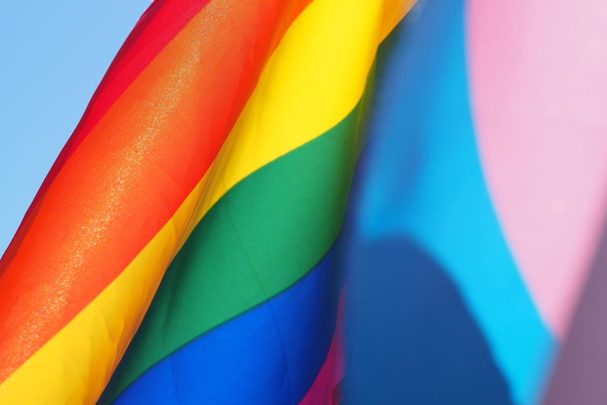 BYU student protests school's LGBTQ policy by revealing a rainbow flag in her graduation gown