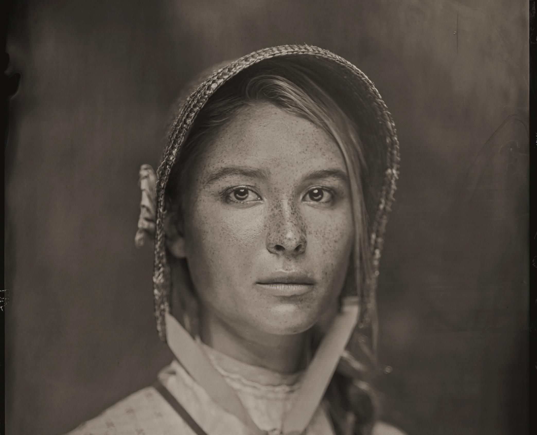 An old west style photo of actress Isabel May as Elsa Dutton from the Paramount+ show 1883.