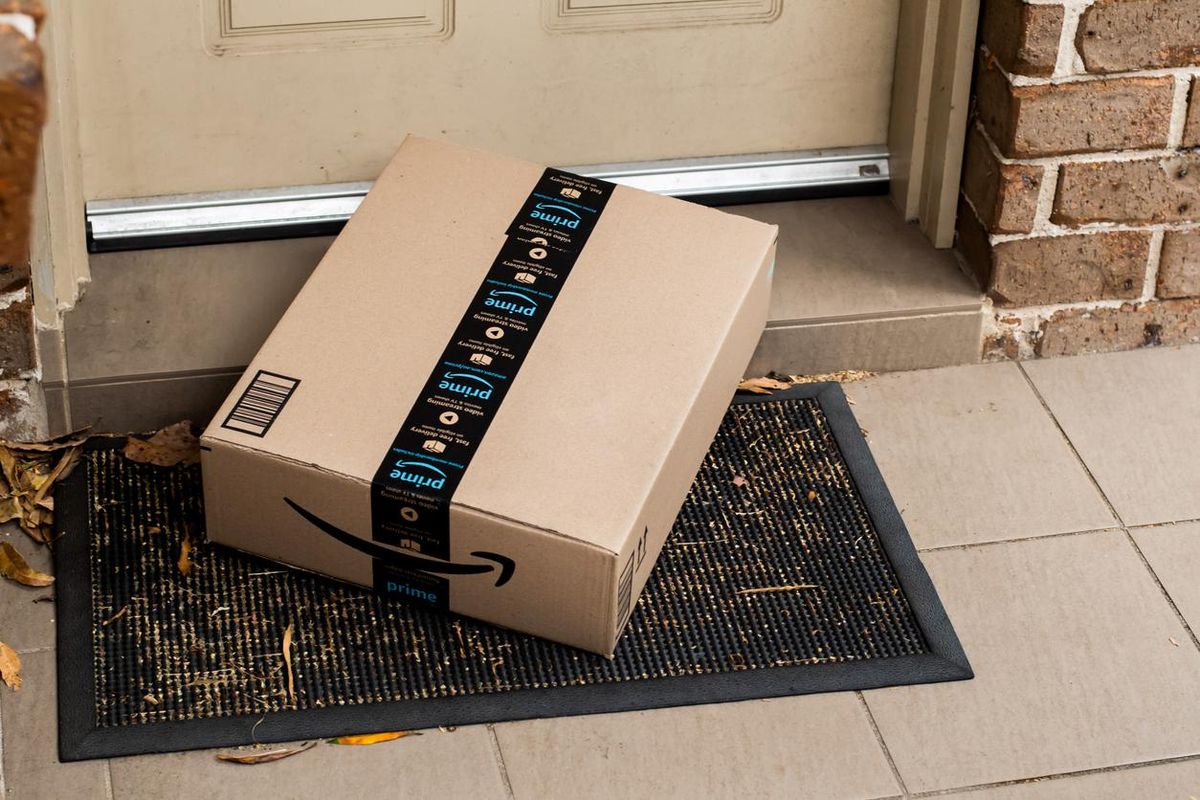 a photo of an Amazon Package delivered to a front door