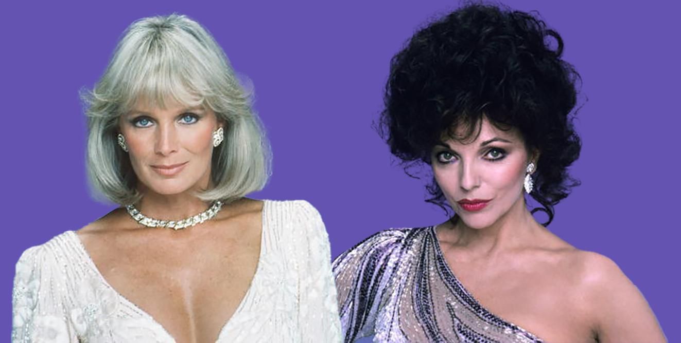 Linda Evans and Joan Collins of Dynasty pose against a backdrop while wearing their character's signature high-fashion outfits.