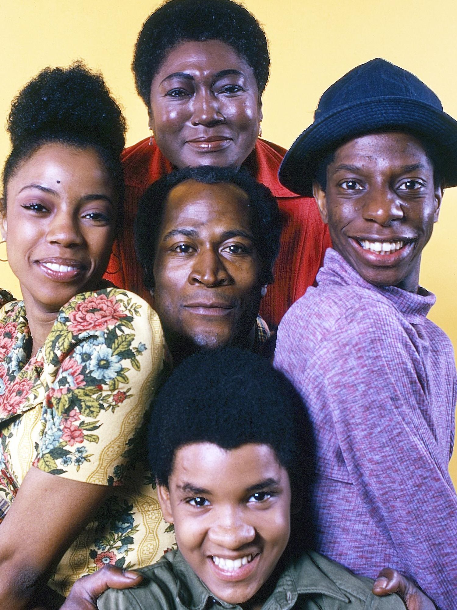 The stars of Good Times pose for a family portrait with John Amos in the center.