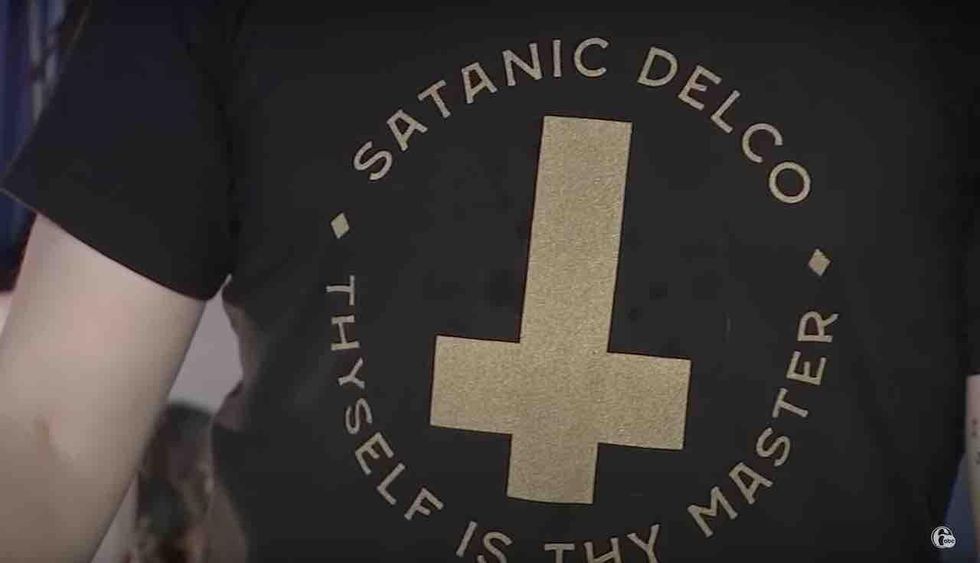 Satanic group gets school district to drop rule banning clothes with satanic, cultic references. Satanic group's leader exults that school officials 'caved.'