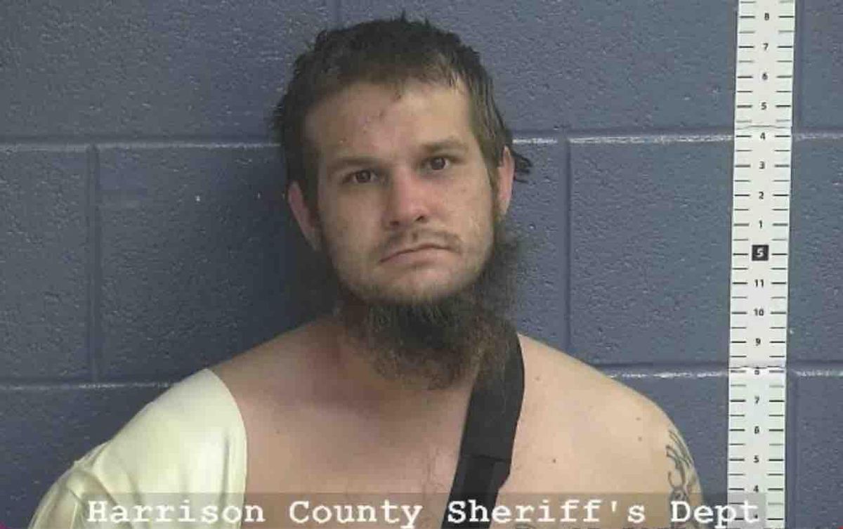 Chainsaw-wielding fugitive walks toward deputy, who orders him to put it down. Instead, fugitive grabs shotgun, points it at deputy — who then opens fire on suspect.