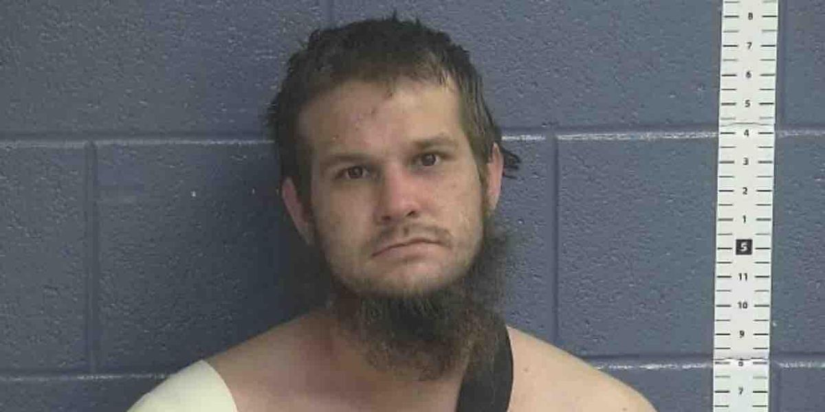 Chainsaw-wielding fugitive walks toward deputy, who orders him to put it down. Instead, fugitive grabs shotgun, points it at deputy — who then opens fire on suspect.