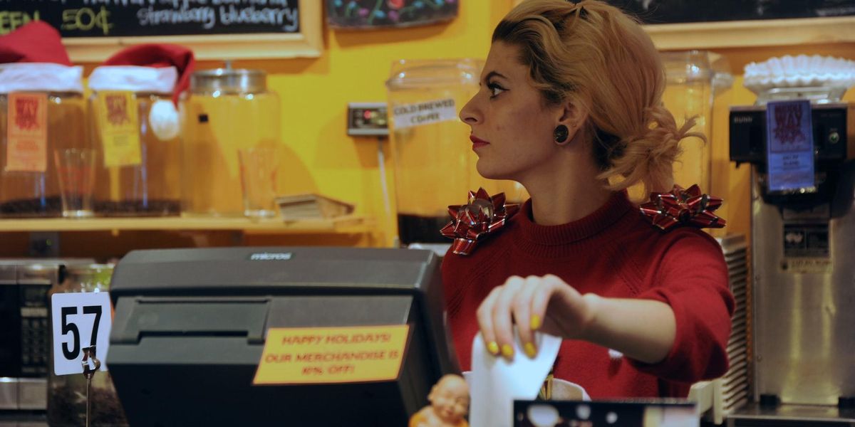 Women ripping a receipt in a restaurant
