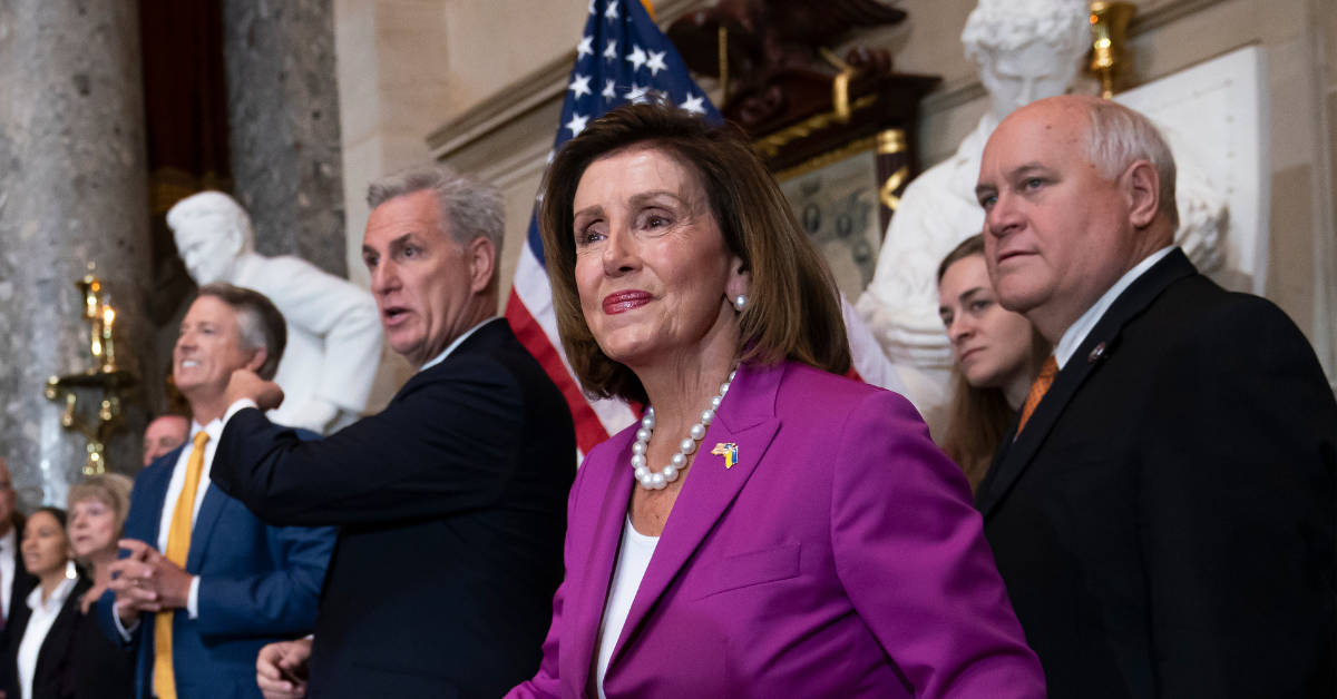 Kevin McCarthy and Nancy Pelosi flanked by other members of Congress