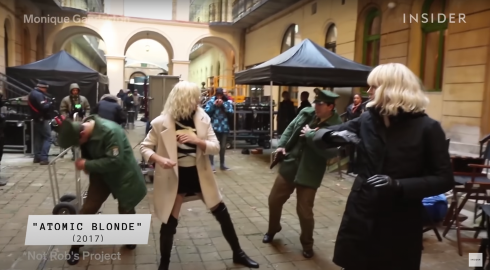 Still from the movie atomic blonde showing actress Charlize Theron and her stunt double in a street fight.