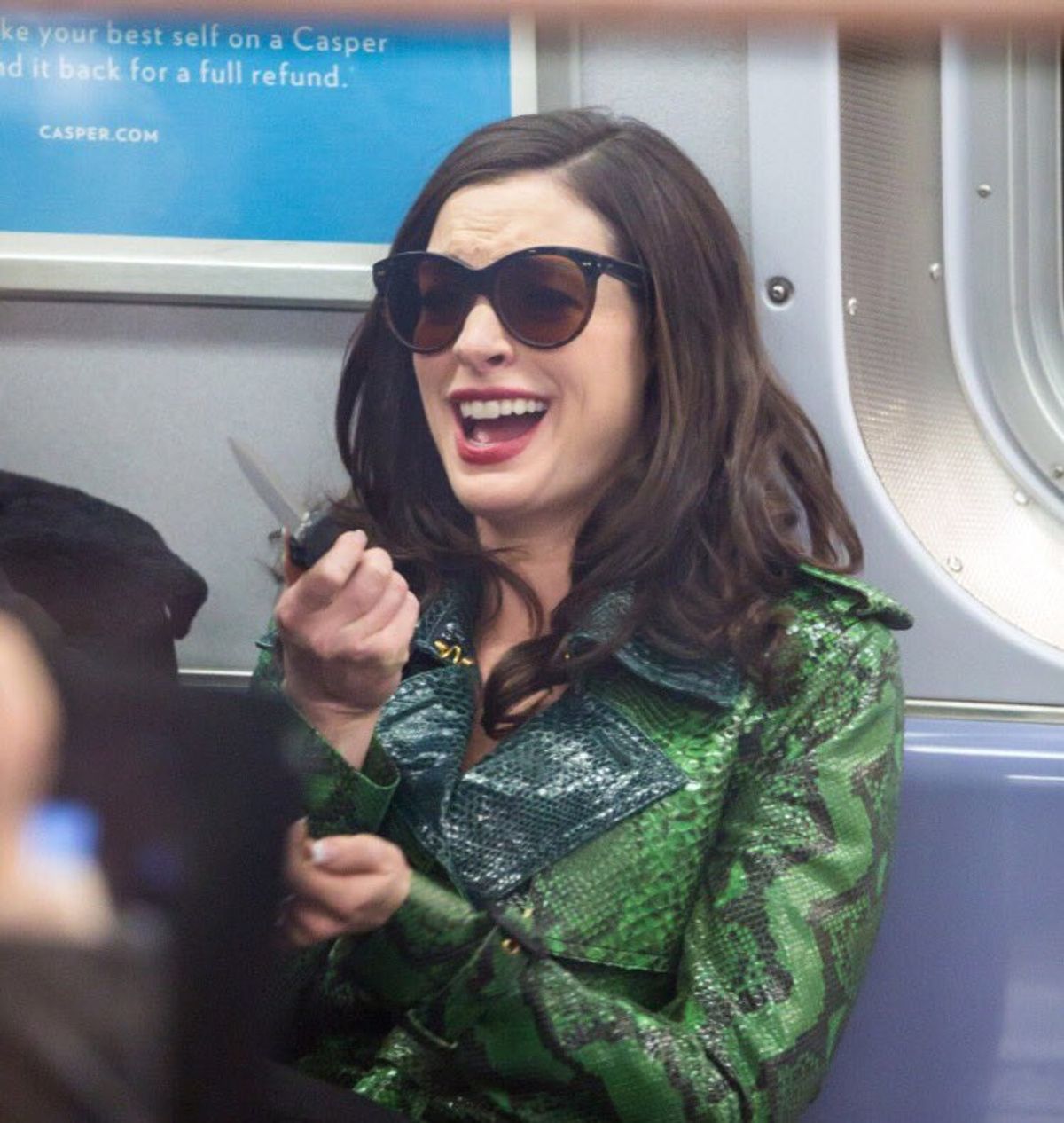 Anne Hathaway Holding a Knife and Laughing is All of Us During the Holidays
