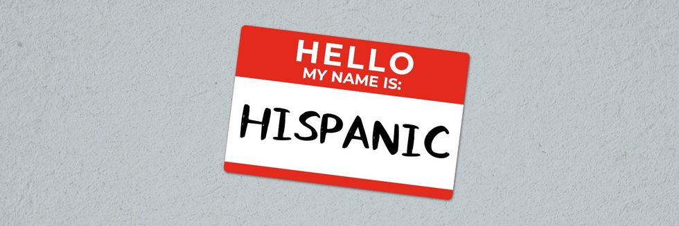 a name tag that says Hispanic