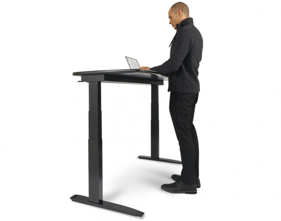 A Man standing at a desk working