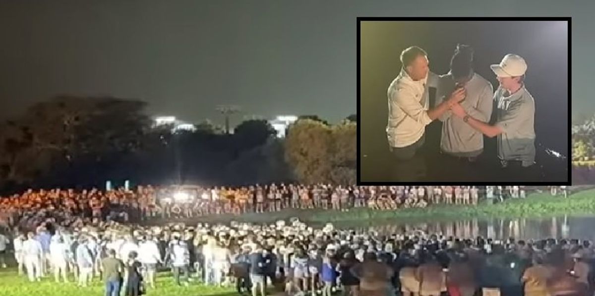 NextImg:Auburn head football coach Hugh Freeze baptizes player at giant Christian revival event
