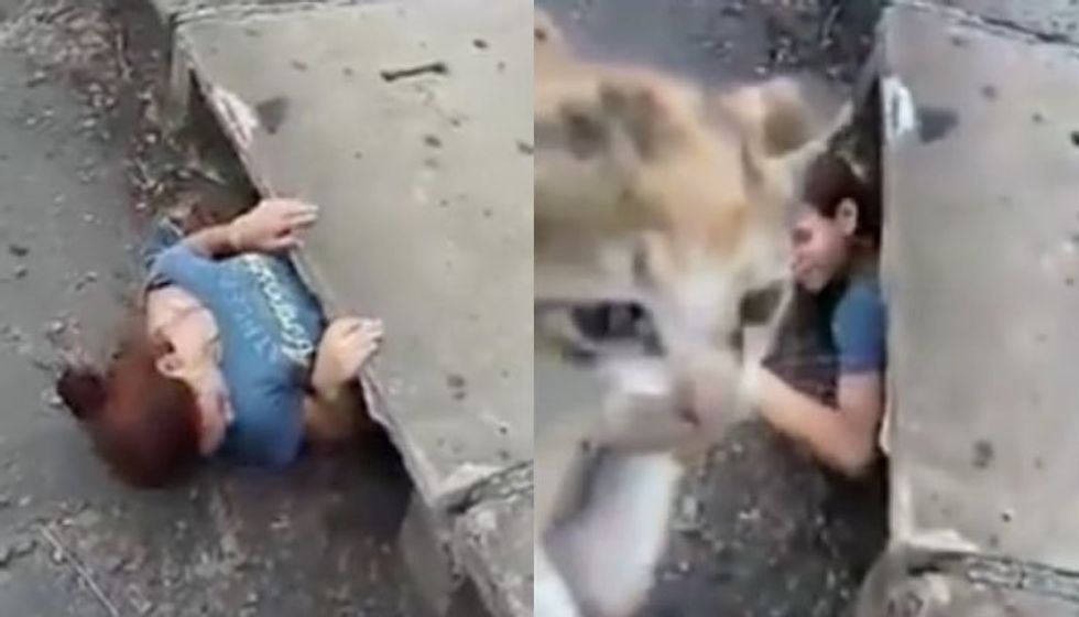 Young Woman Squeezes into a Sewer to Save Trapped Kitten