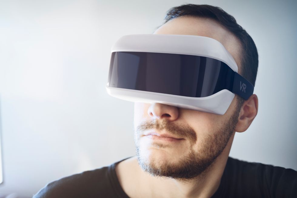 a man wearing vr headset photo