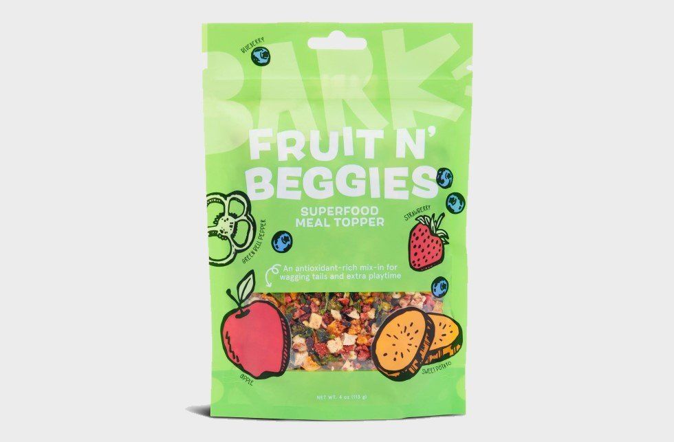 Green bag of "Fruit N' Beggies" superfood meal topper for pets with fruit illustrations.