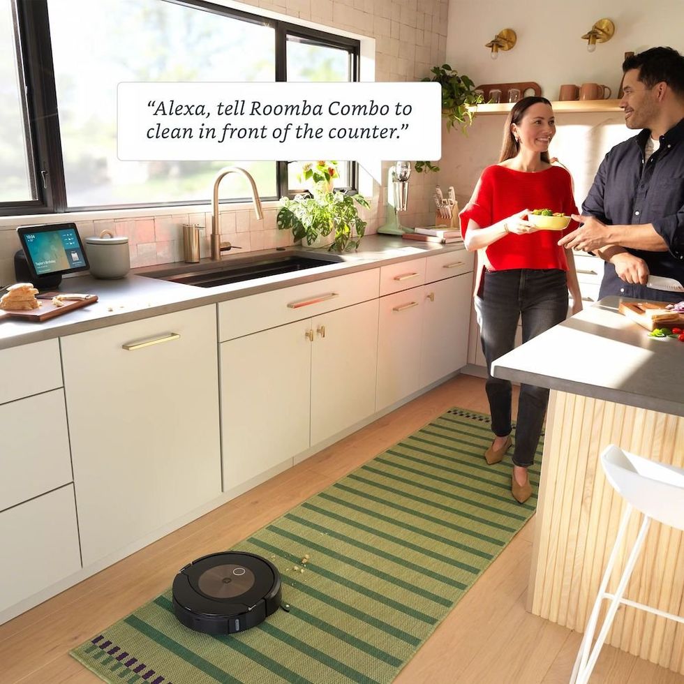  iRobot Roomba j9+ robot vacuum and mop cleaning the kitchen floor