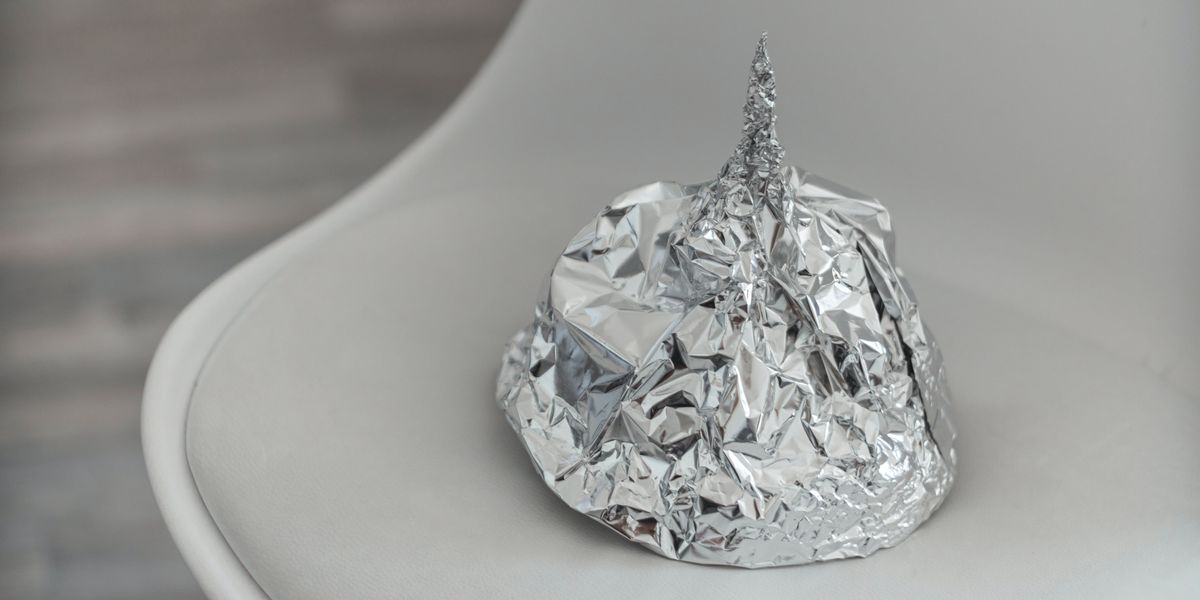 A tin foil hat resting on a chair