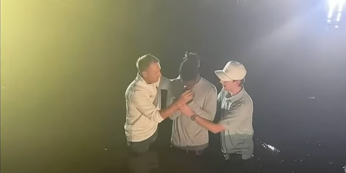 NextImg:Anti-religious group claims Auburn University's football coach attending massive Christian revival on campus is 'unconstitutional'