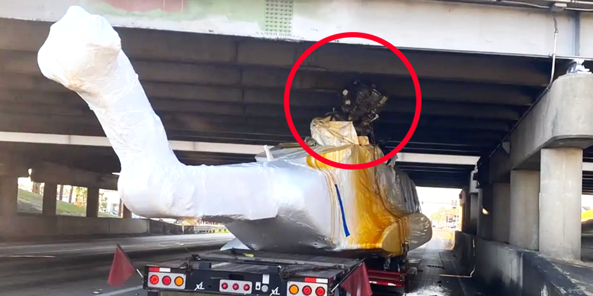 $32 million helicopter jammed into underside of Louisiana overpass by truck driver, spilling fluid everywhere