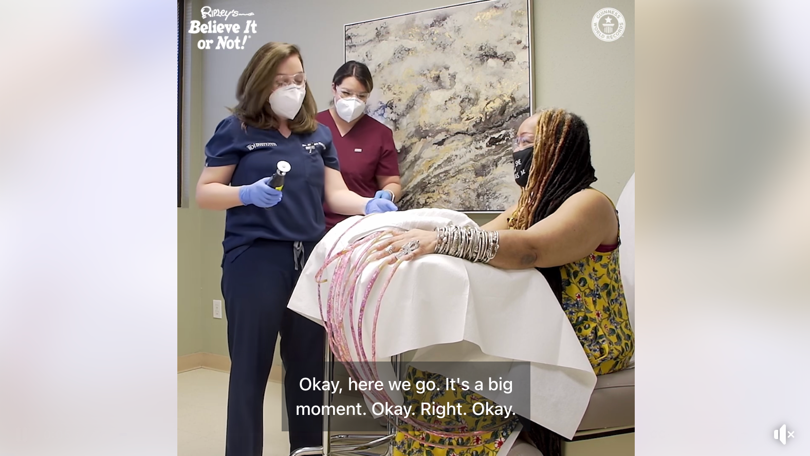 guinness world records; world's longest nails; woman cuts world record nails; guinness book of world records