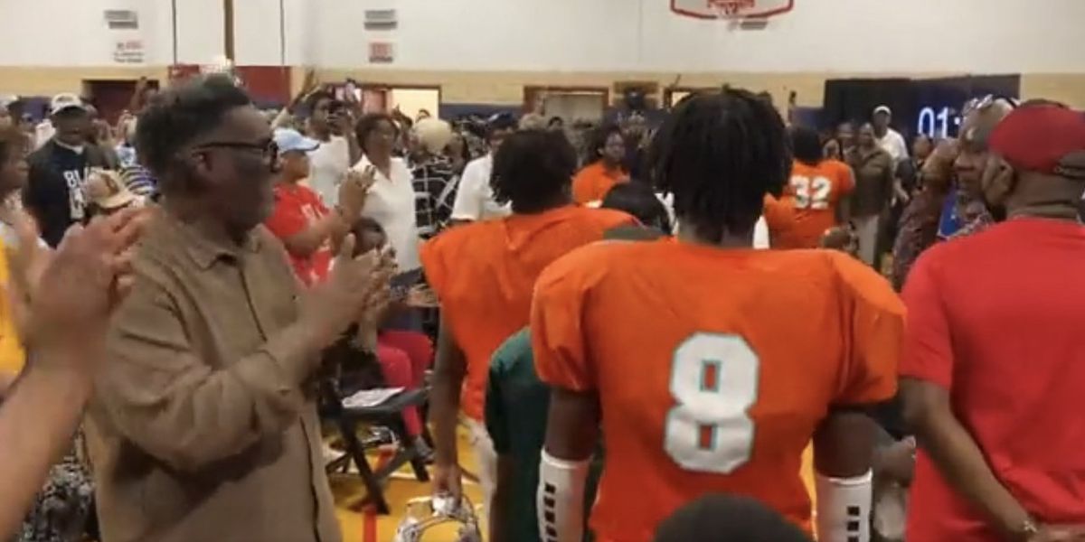 NextImg:Video: Chicago youth football players protest getting booted from field house to make room for migrants; march into local meeting wearing their gear to wild cheers