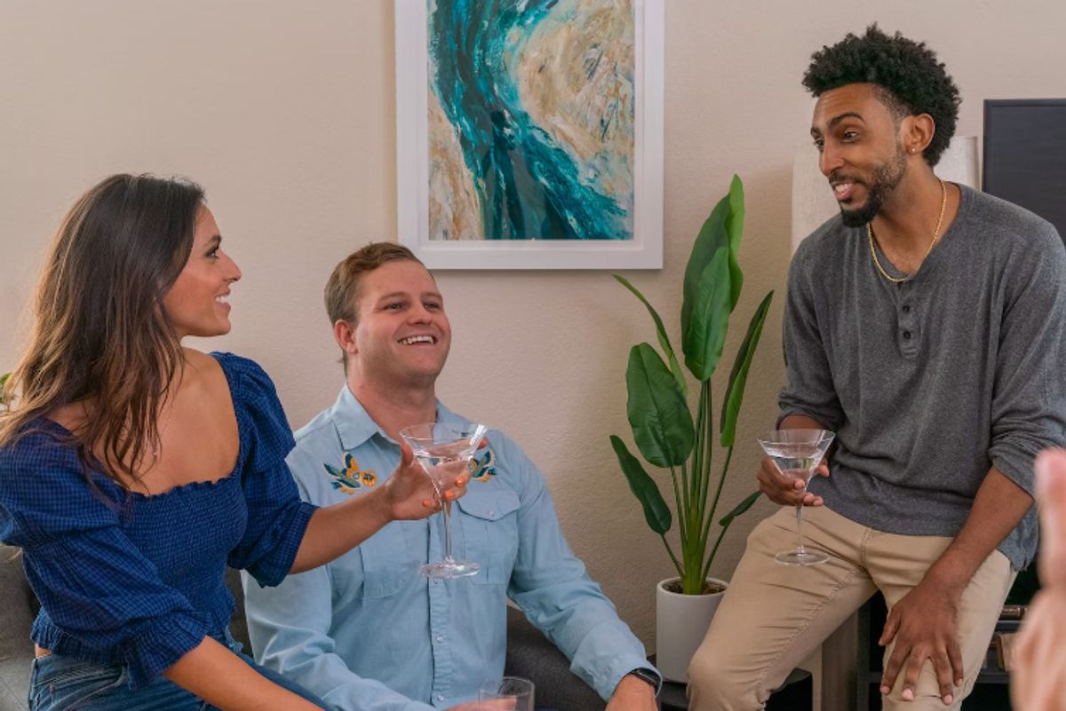 three people in conversation.