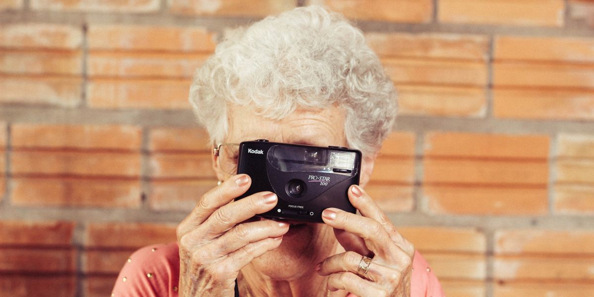 Senior citizen using a camera